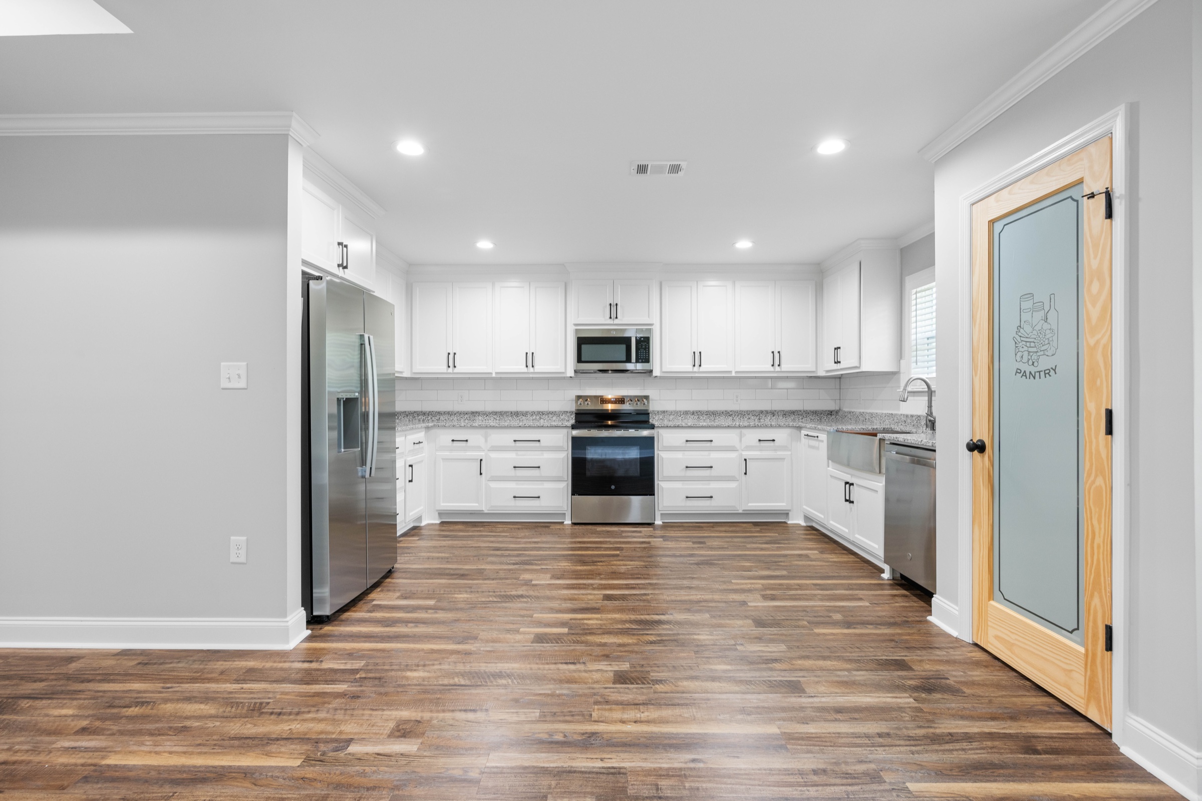 Bright white kitchen photographed for a real estate listing